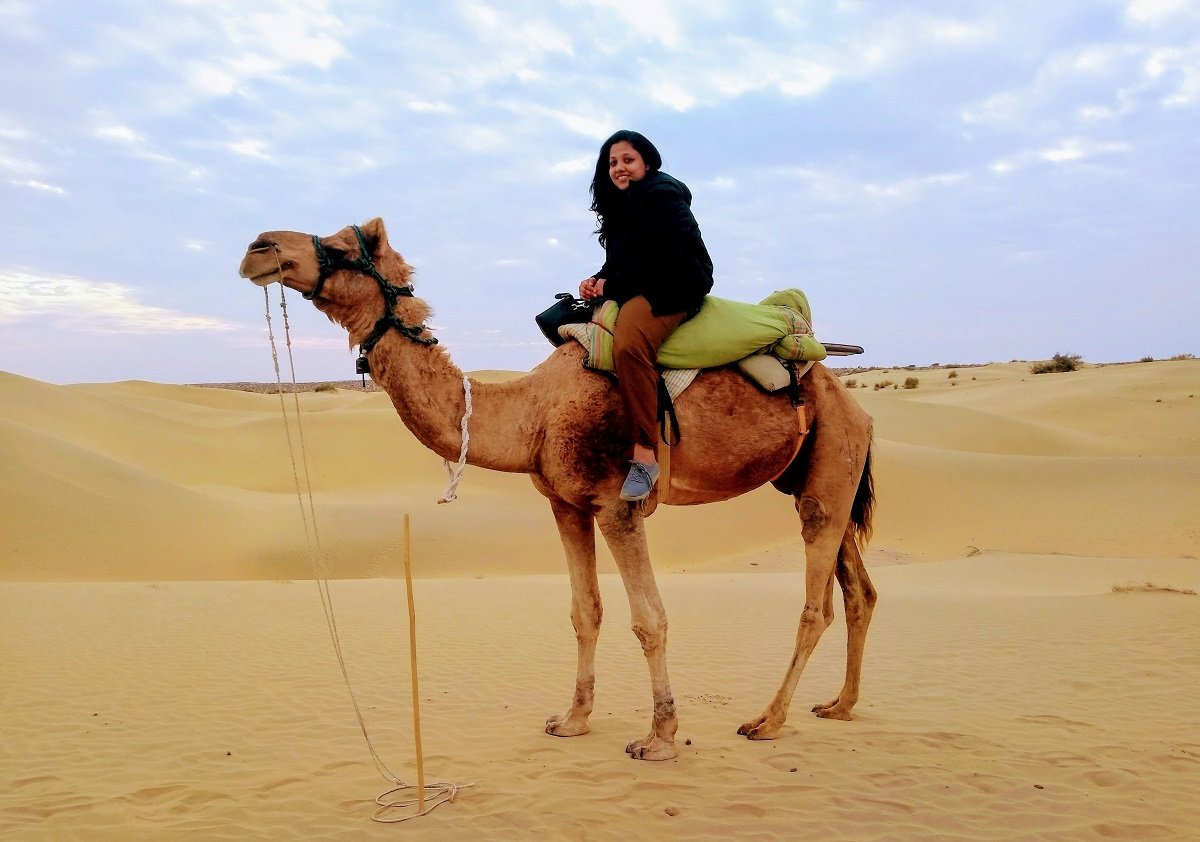 Shubhra on her way to the desert safari on a camel in Rajasthan 