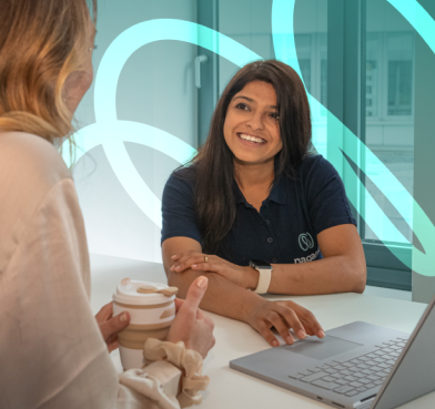 Women employees discussing in the Nagarro office.
