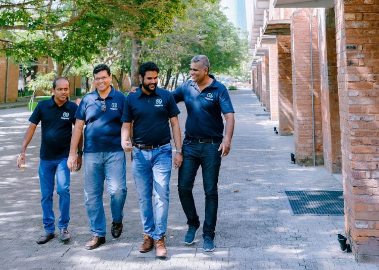Four men taking a casual walk as colleagues
