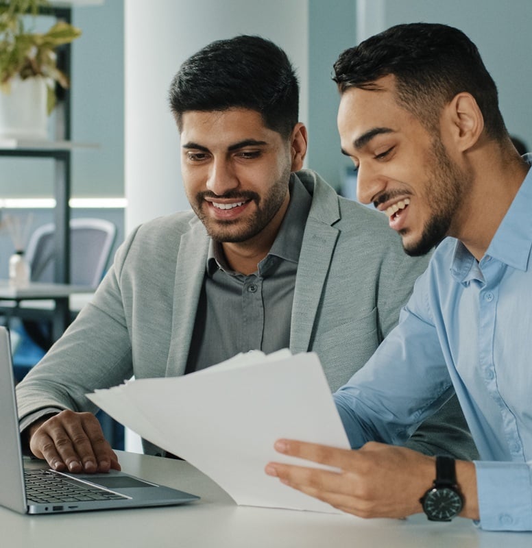 Two men looking at the application form.