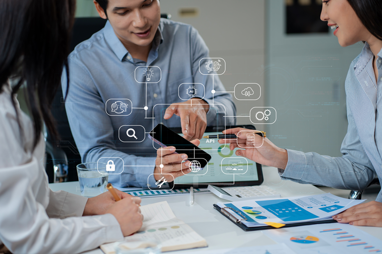 A man showing his mobile application to his colleagues.