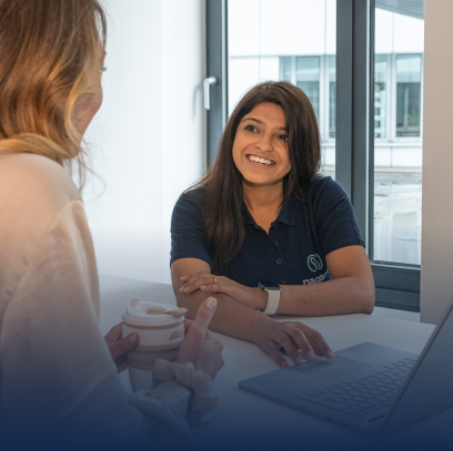 Empower Employees: Happy female employee sitting in office