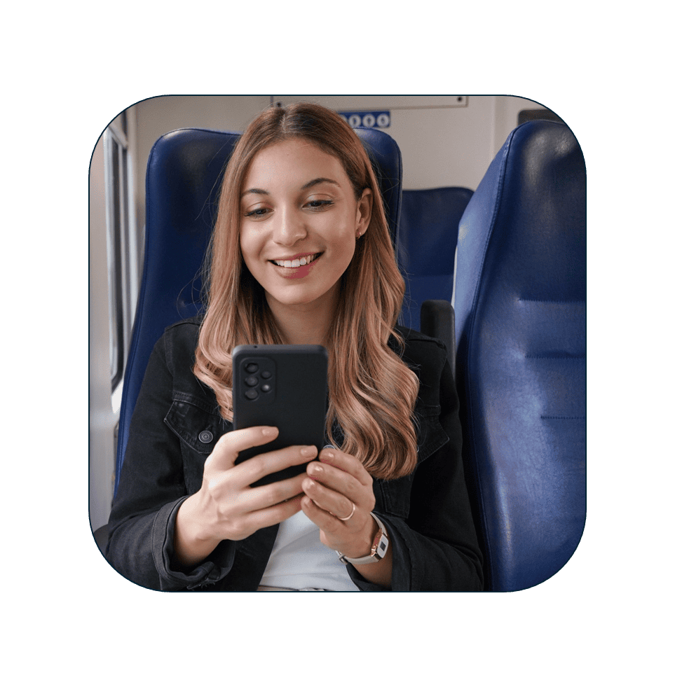 Business executive in a train filling reimbursement application via mobile phone (1)