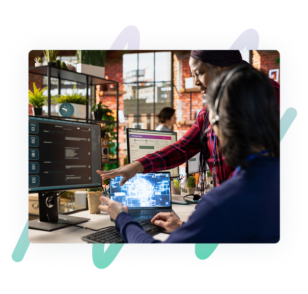 Developers working together in front of a computer screen depicting SAP Business Technology Platform