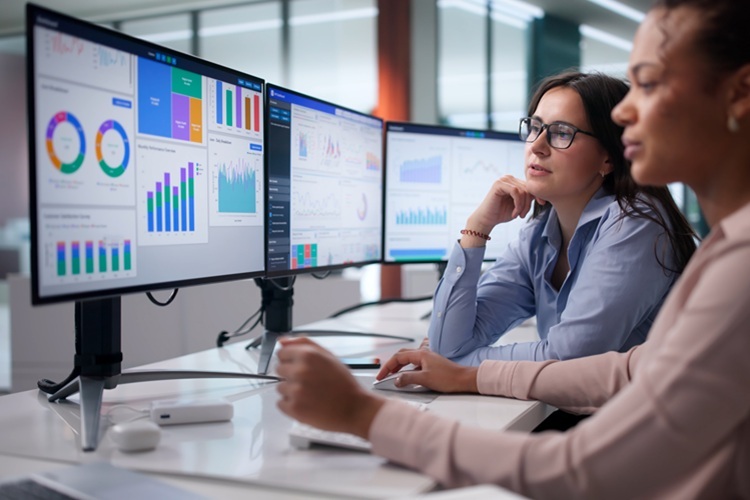 Finance Team analyzing data on a computer