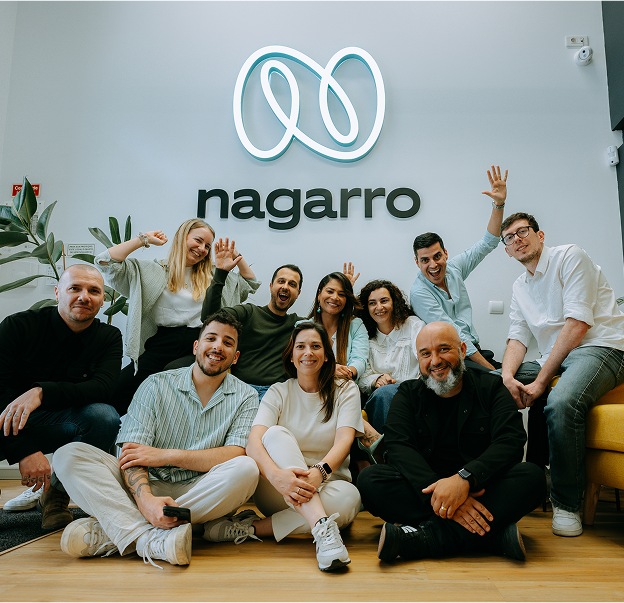 Group of Nagarrians with the Nagarro logo in the background