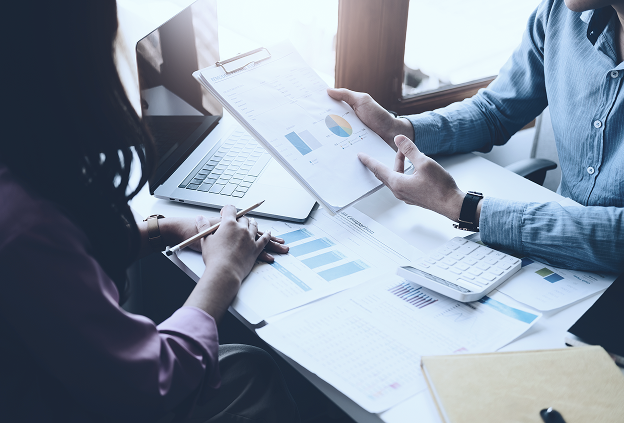 Colleagues are analyzing the data, such as charts and graphs.