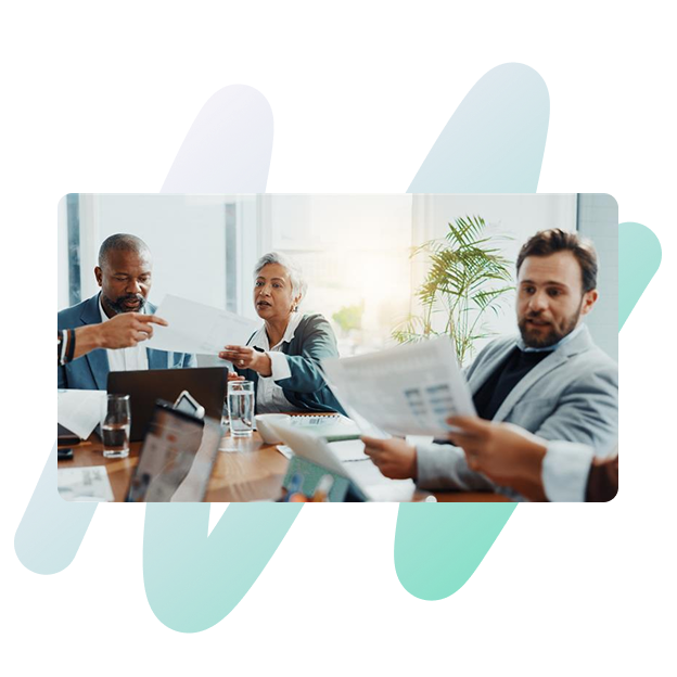 People working in a team setting in a meeting room