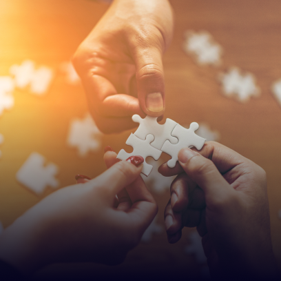 Three people playing puzzle game representing integration