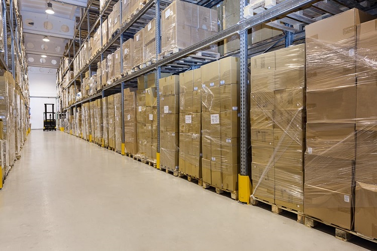 Metal stillage in a warehouse with cartons_tile