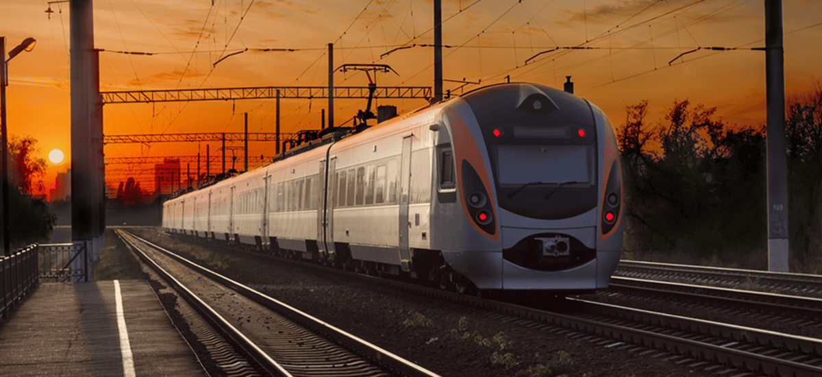 Passenger train on railway tracks during sunset_ground transportation image_d