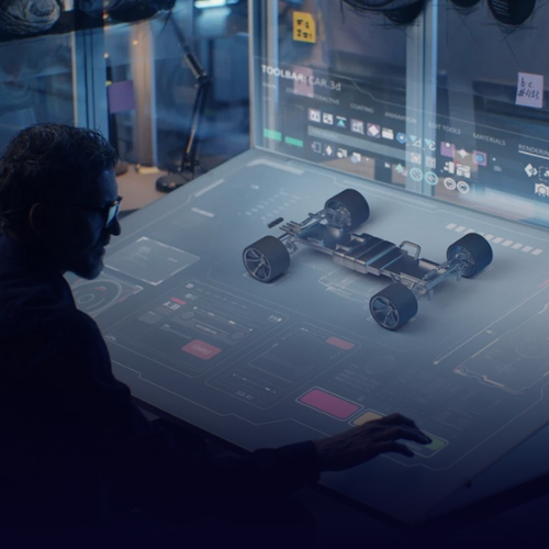 A man implementing the car design on the software application.