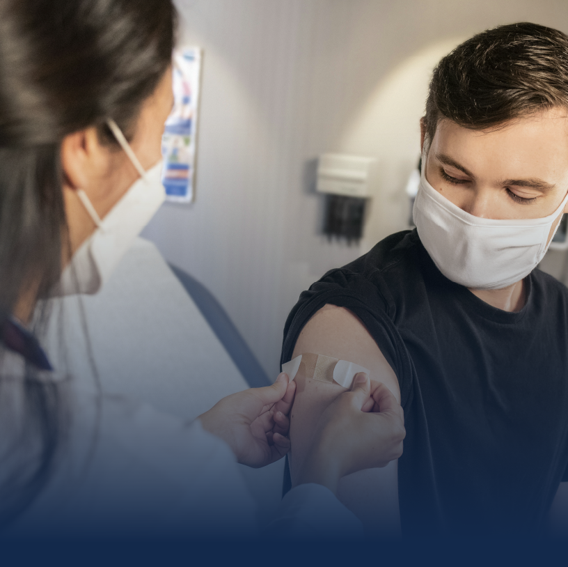 Doctor giving Vaccines to the patients.