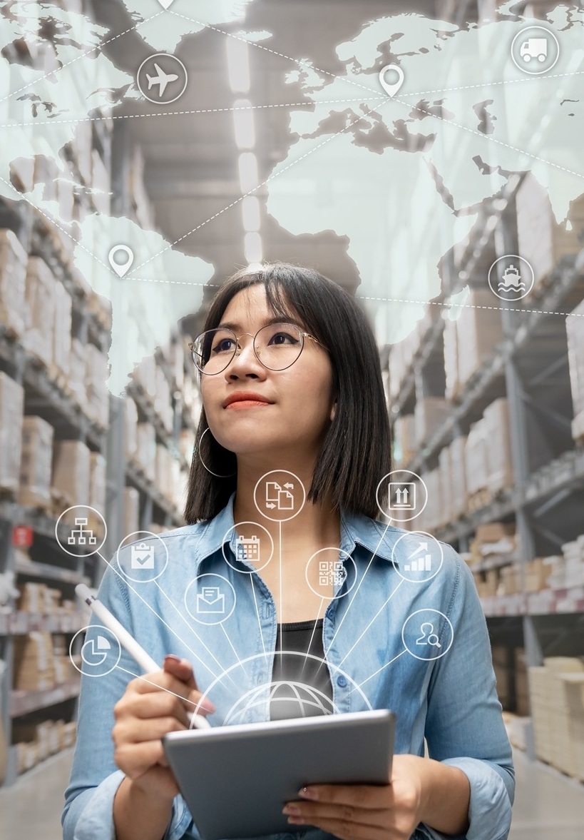 Woman-looking-at-inventory-in-warehouse-using-smart-tablet